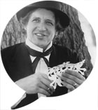 Photo of Randel McGee with paper sculpture